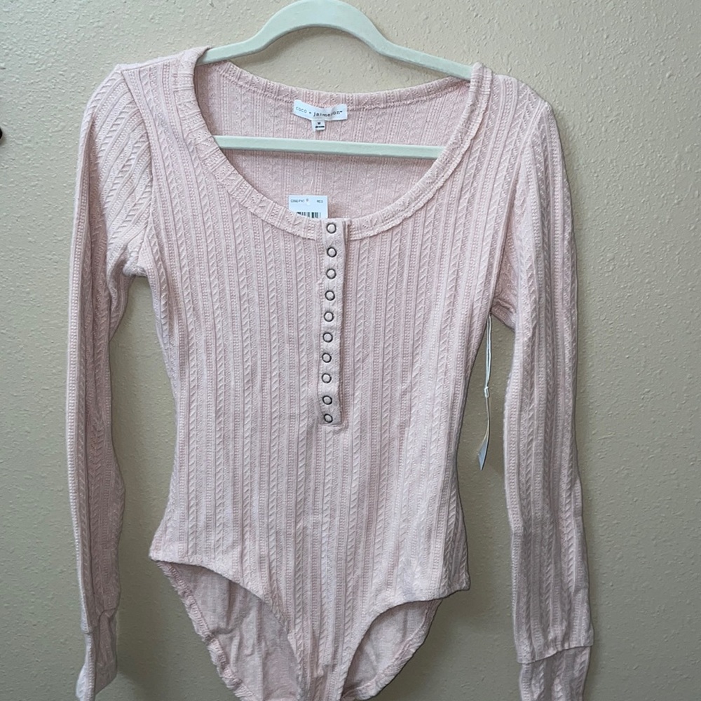 Light pink long sleeve bodysuit, NWT, size M